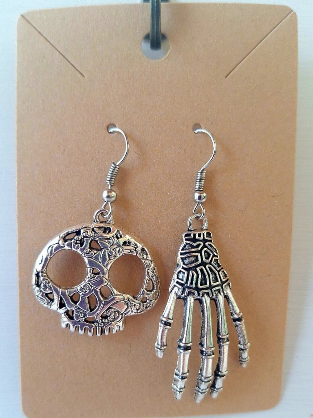 Skull & Skeleton Hand Mismatched Earrings – Silver‑Tone Gothic Style